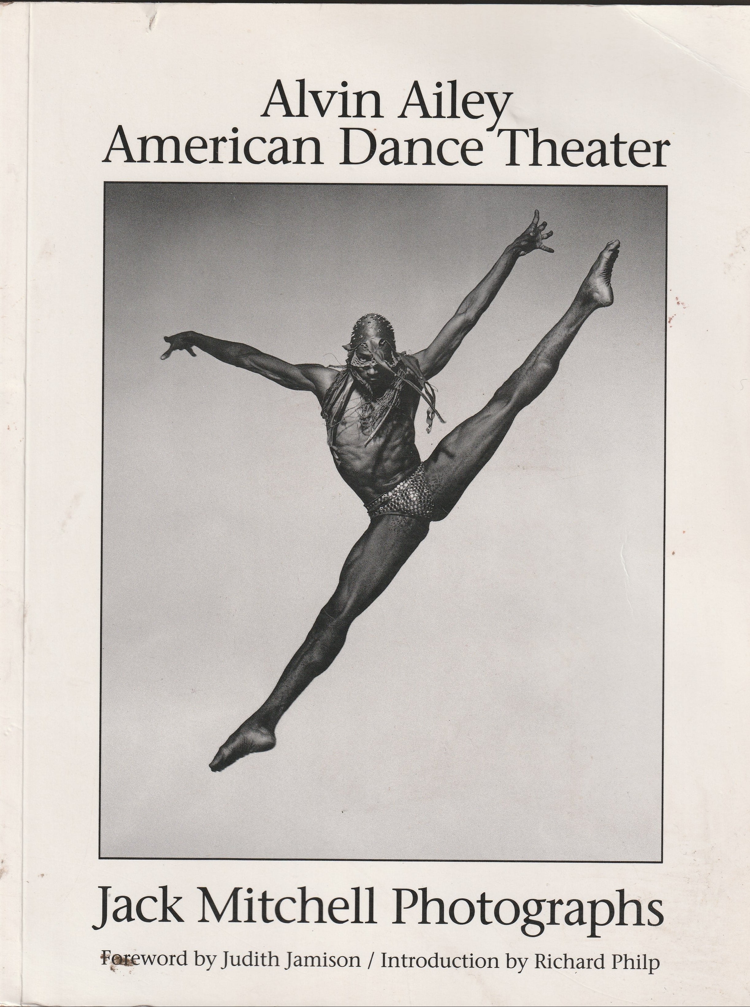 Book cover featuring a dancer in mid-air with 'Alvin Ailey American Dance Theater' and 'Jack Mitchell Photographs' text.